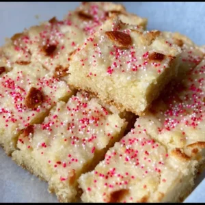 Almond flour sugar cookie bars, gluten-free dessert option on a plate.