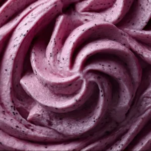 Delicious blackberry frosting spread on a cake slice